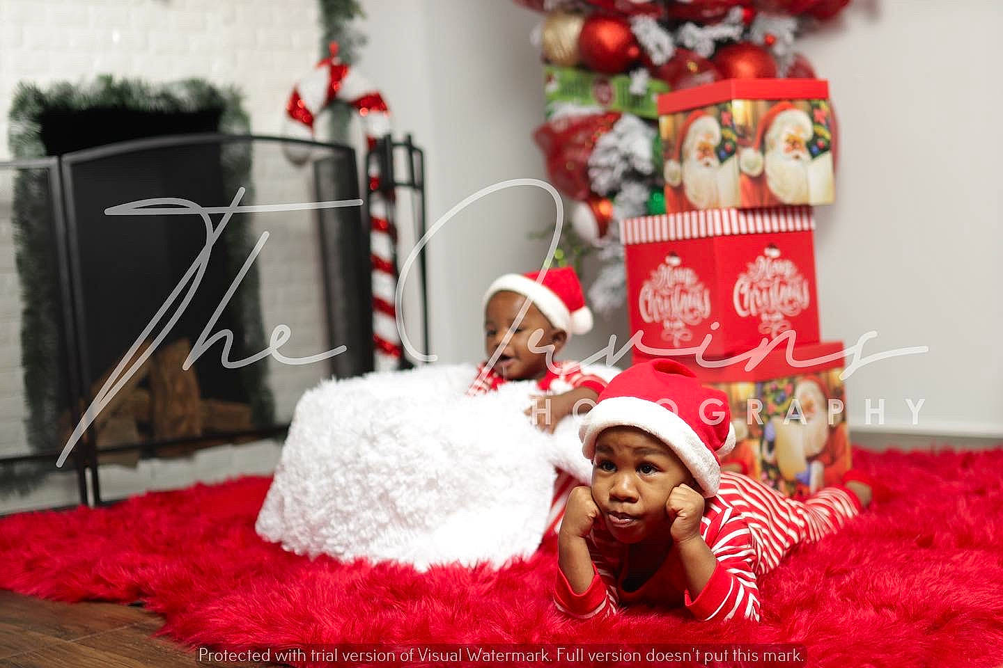 Samair is registered to the contest to win money with this photo: baby, carmine, child, christmas, christmas_decoration, christmas_eve, christmas_ornament, decoration, event, flooring, happy, headwear, holiday, interior_design, linens, ornament, person, red, room, santa_claus