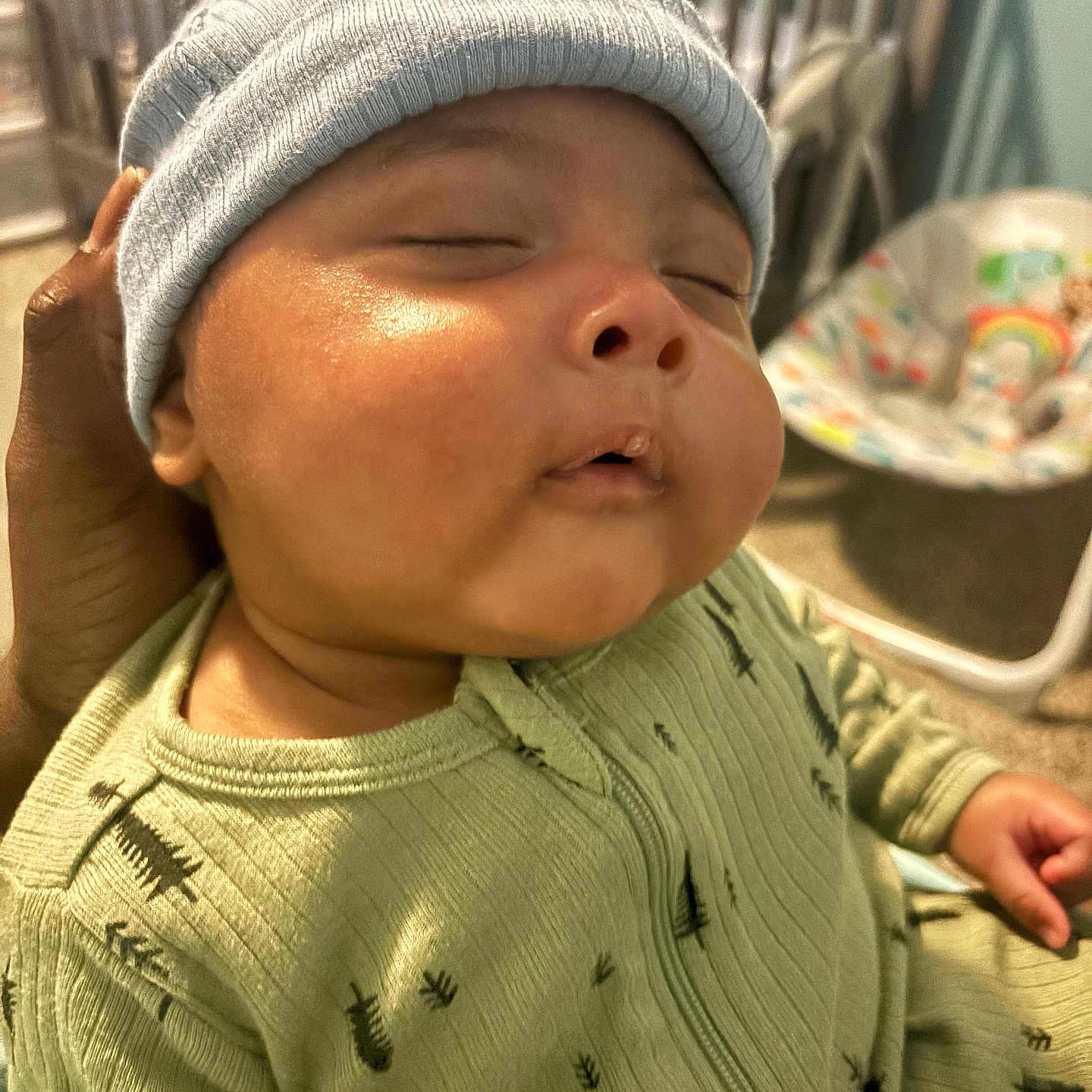 Michael is registered to the contest to win money with this photo: animal, baby, beanie, bonnet, cap, clothing, crib, face, furniture, hat, head, infantbed, insect, invertebrate, knitwear, newborn, person, photography, portrait, sweater