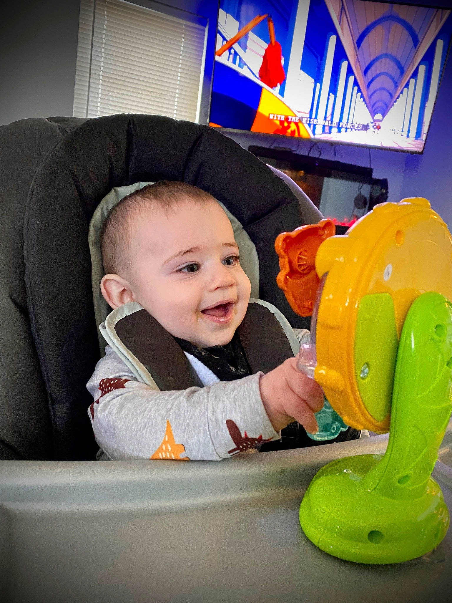 Conor is registered to the contest to win money with this photo: baby, baby_products, baby_toddler_clothing, blue, child, comfort, fun, happy, head, leisure, person, personal_protective_equipment, plastic, product, recreation, room, sitting, smile, toddler, yellow