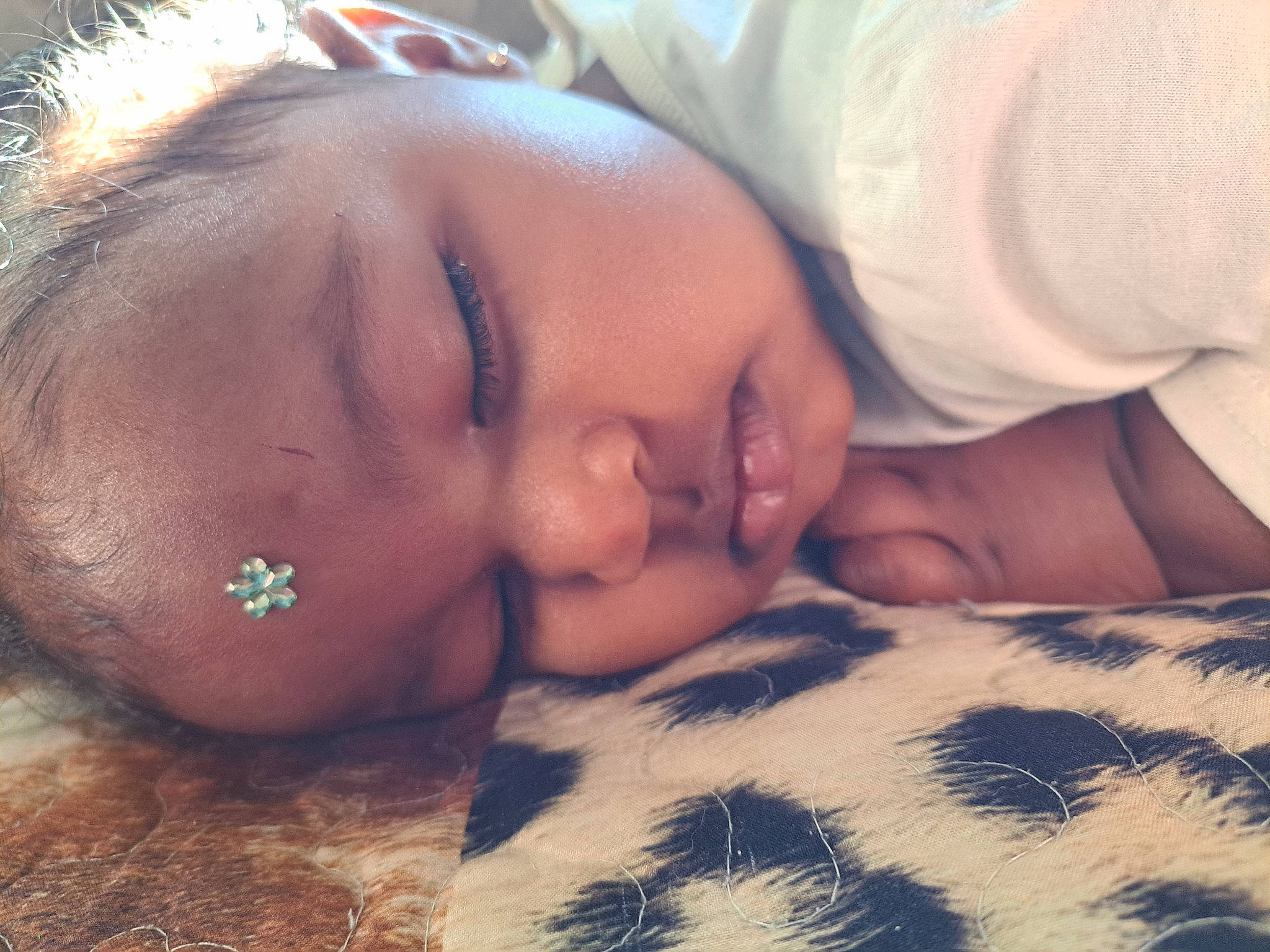 Skyler is registered to the contest to win money with this photo: baby, bedtime, child, close_up, comfort, eyelash, facial_expression, finger, forehead, grass, hand, happy, linens, love, nap, nose, people_in_nature, person, skin, toddler