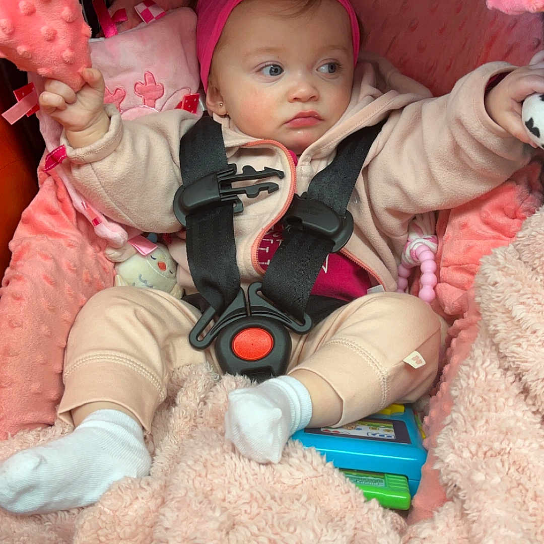 Laylanni is registered to the contest to win money with this photo: baby, bed, bonnet, cap, car, car_interior, carseat, clothing, crib, face, furniture, hat, head, hosiery, person, photography, portrait, sock, transportation, vehicle