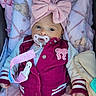 Selene joined the competition — help win amazing prizes! baby, infant, child, portrait, lying_down, pacifier, bow, headband, jacket, pink, burgundy, blanket, clothing, skirt, baby_carrier, smiling, face, eyes, indoor, cozy