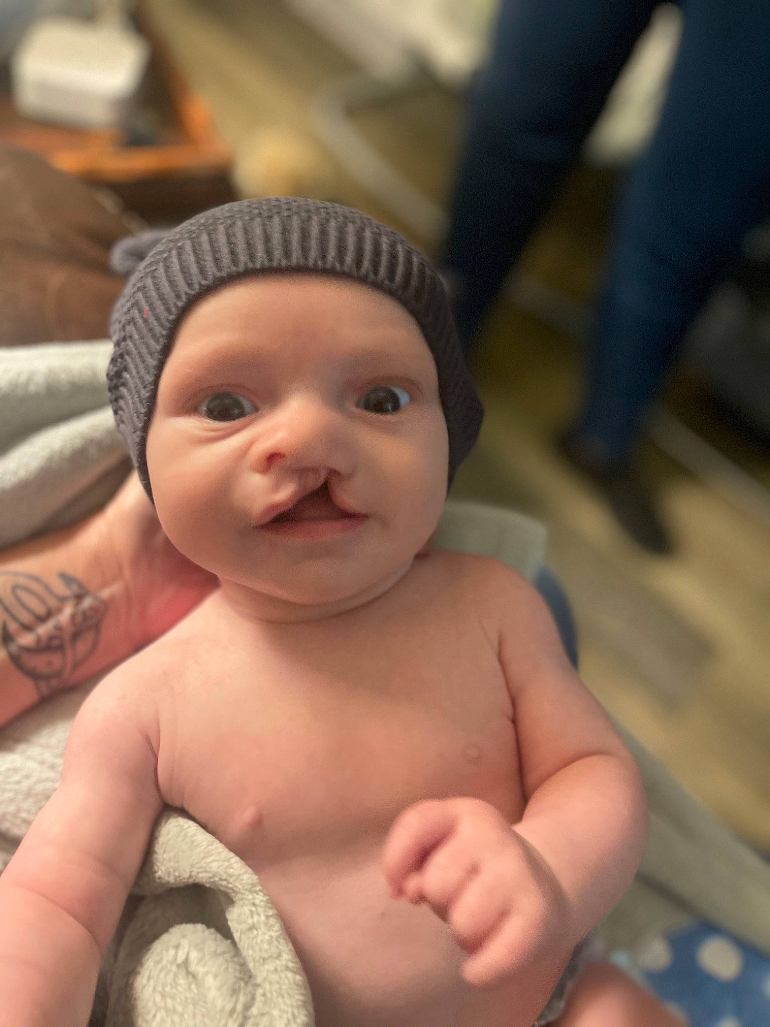 Andrew is registered to the contest to win money with this photo: abdomen, baby, barechested, cap, cheek, chest, child, chin, eyebrow, finger, happy, headwear, lip, mouth, nose, person, skin, smile, stomach, thumb