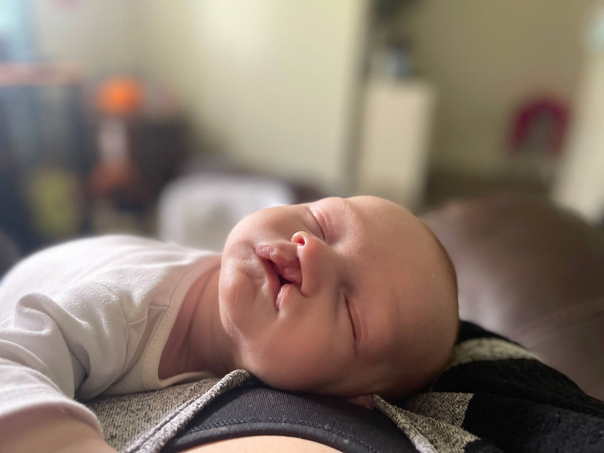 Andrew is registered to the contest to win money with this photo: baby, baby_toddler_clothing, cheek, child, comfort, eye, eyebrow, eyelash, flash_photography, flooring, grass, happy, iris, lip, person, portrait_photography, room, sitting, skin, smile