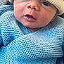 baby, newborn, infant, beanie, hat, knit_blanket, blue_blanket, swaddle, closeup, portrait, face, eyes, lips, skin, cozy, indoor, hand, blanket_texture, cute, awake