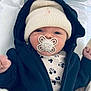 baby, newborn, infant, pacifier, elephant_pacifier, beanie, hat, hoodie, jacket, onesie, mickey_mouse, bassinet, hospital, blanket, cozy, portrait, face, hands, cute, sleepy