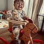 Maylone participe au concours pour gagner de l'argent avec cette photo : child, toddler, rocking_horse, wooden_toy, smile, pajamas, dinosaur_pattern, indoor, curtains, window, hardwood_floor, playroom, shoe, sock, seat, portrait, happy, hands, red, furniture
