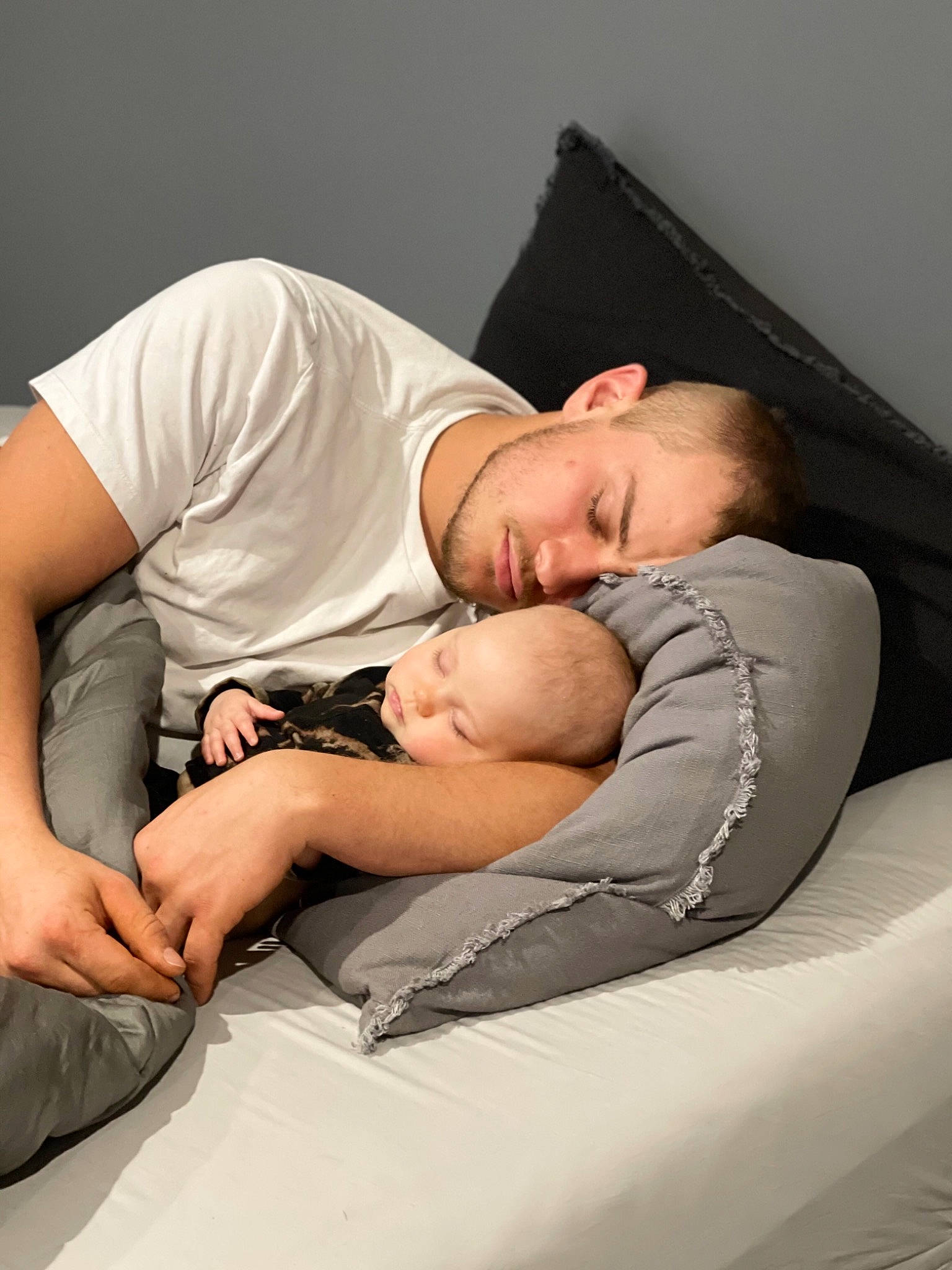Blakelynn is registered to the contest to win money with this photo: abdomen, arm, baby, bedding, bedtime, child, comfort, couch, elbow, finger, flash_photography, hand, human_leg, leg, linens, nap, person, room, shoulder, sitting