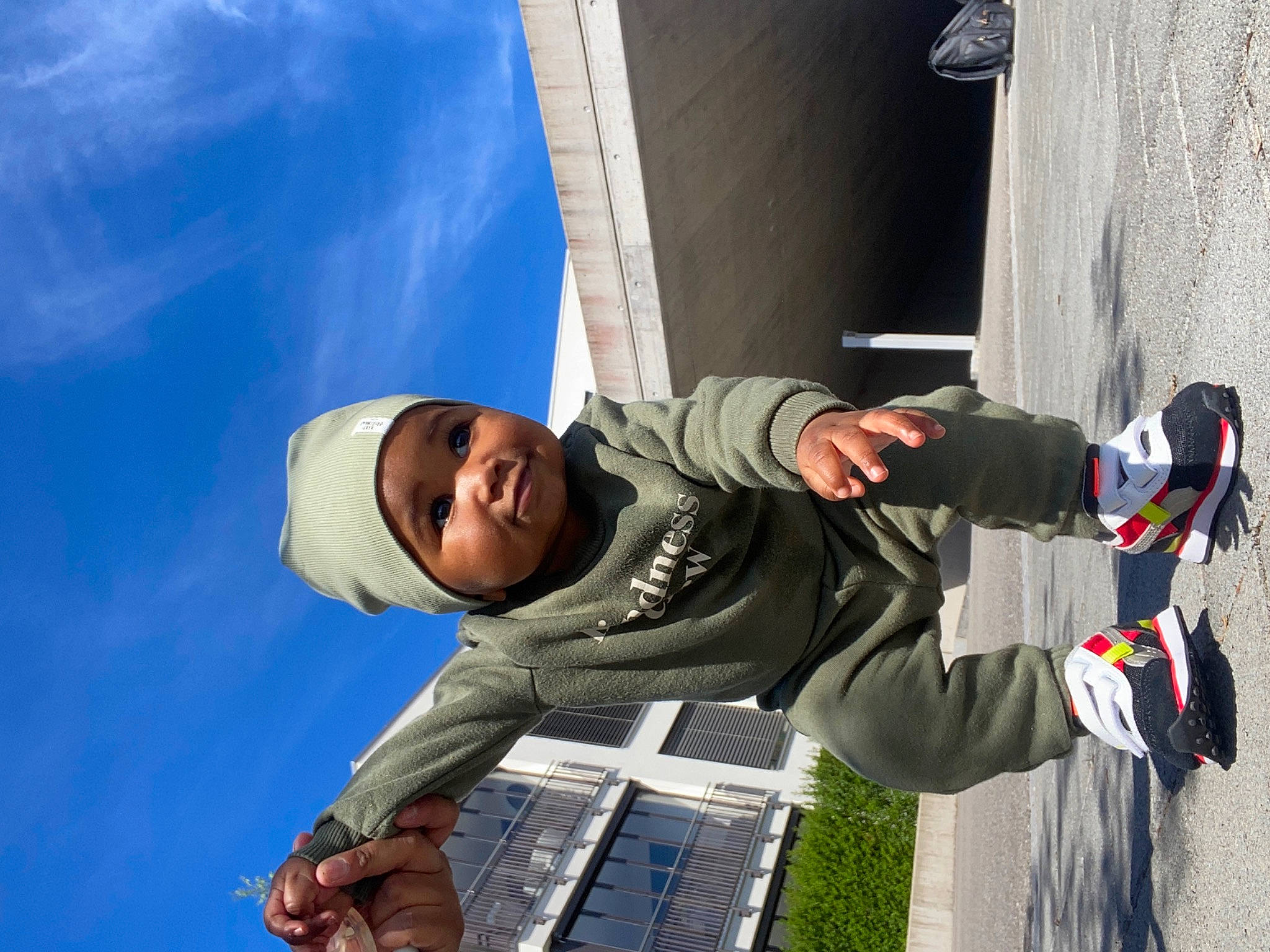 Bryan Rafel participe au concours pour gagner de l'argent avec cette photo : adventure, boot, cloud, denim, elbow, electric_blue, fun, happy, hat, headwear, jacket, leisure, outdoor_shoe, person, recreation, sky, smile, sneakers, street_fashion, toddler