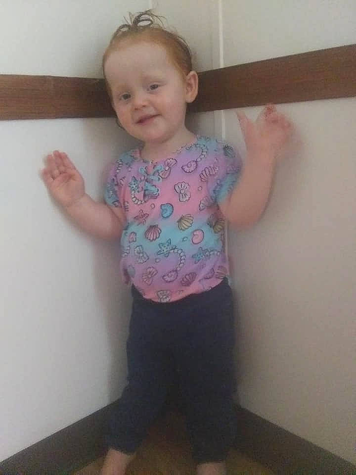 Kristina is registered to the contest to win money with this photo: arm, baby, cheek, child, finger, fun, head, joint, leg, person, pink, shoulder, skin, sleeve, smile, standing, t_shirt, thigh, toddler