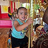 Keshaun joined the competition — help win amazing prizes! amusement_park, amusement_ride, black_shorts, blue_shirt, bright, carousel, child, daylight, decorative, fun, golden_pole, happy, horse, indoor, person, playful, ride, smiling, toddler, wood_floor