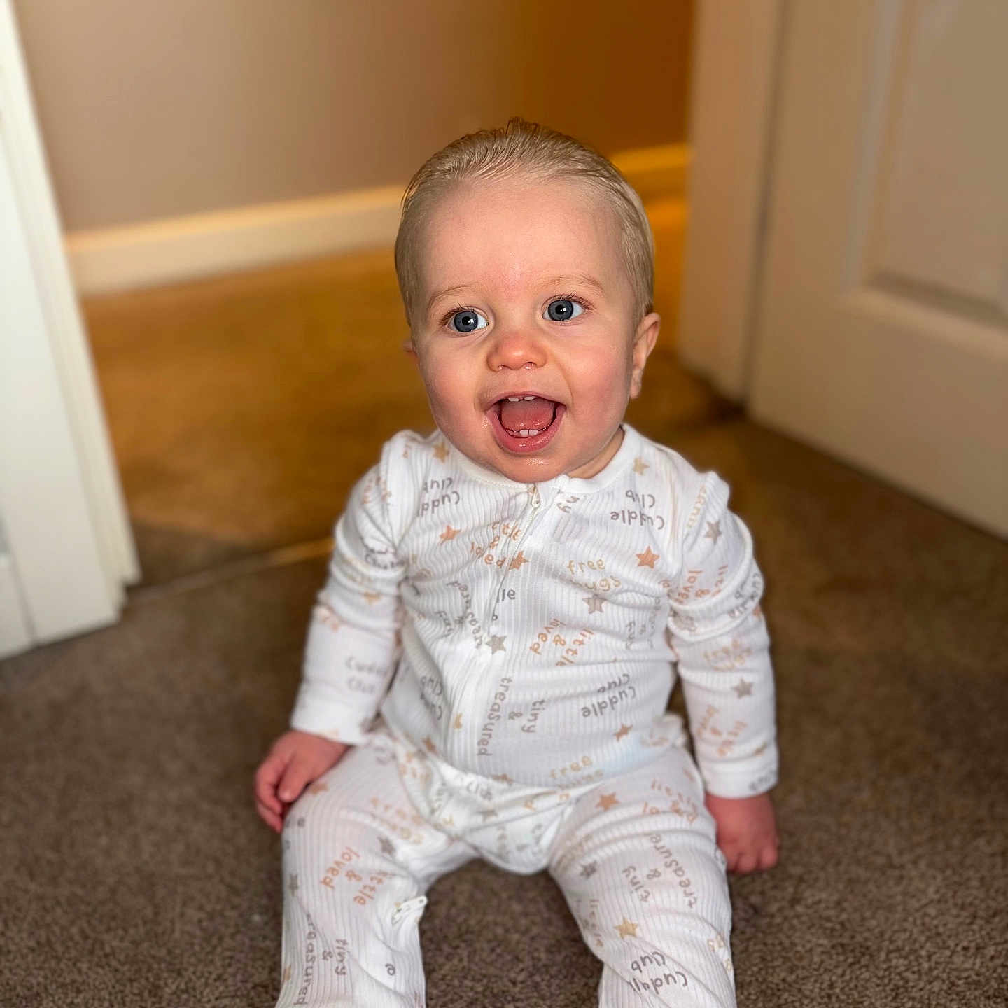 Kaven joined the competition — help win amazing prizes! baby, baby_girl_or_boy, blue_eyes, carpet, child, clothing, cute, door, expression, floor, happy, home_interior, indoor, infant, pajamas, person, portrait, sitting, smiling, young_child