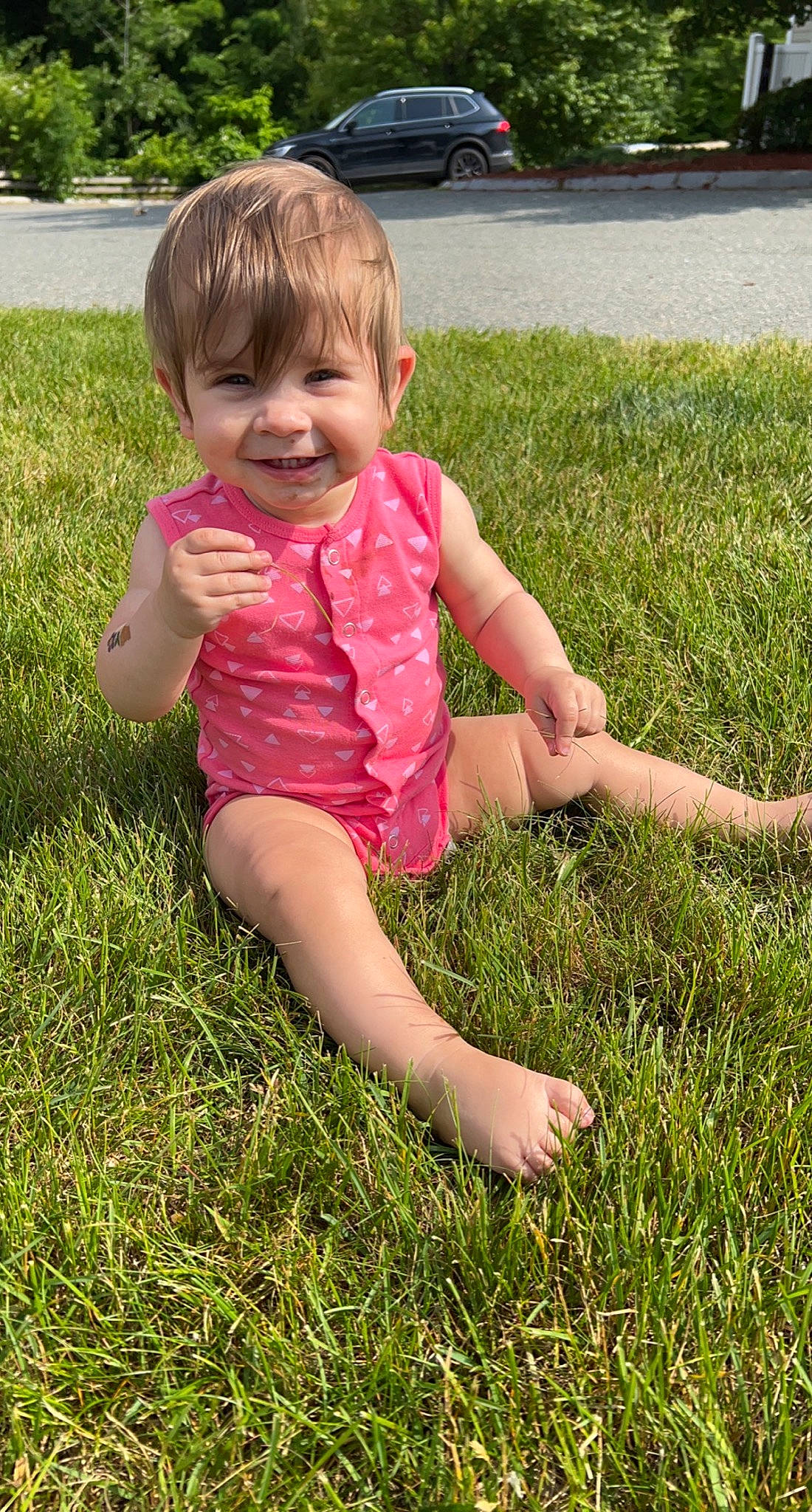Kaelynn joined the competition — help win amazing prizes! baby_toddler_clothing, barefoot, child, eye, finger, fun, grass, grassland, hair, happy, head, human_leg, joy, lawn, meadow, people_in_nature, person, plant, smile, summer