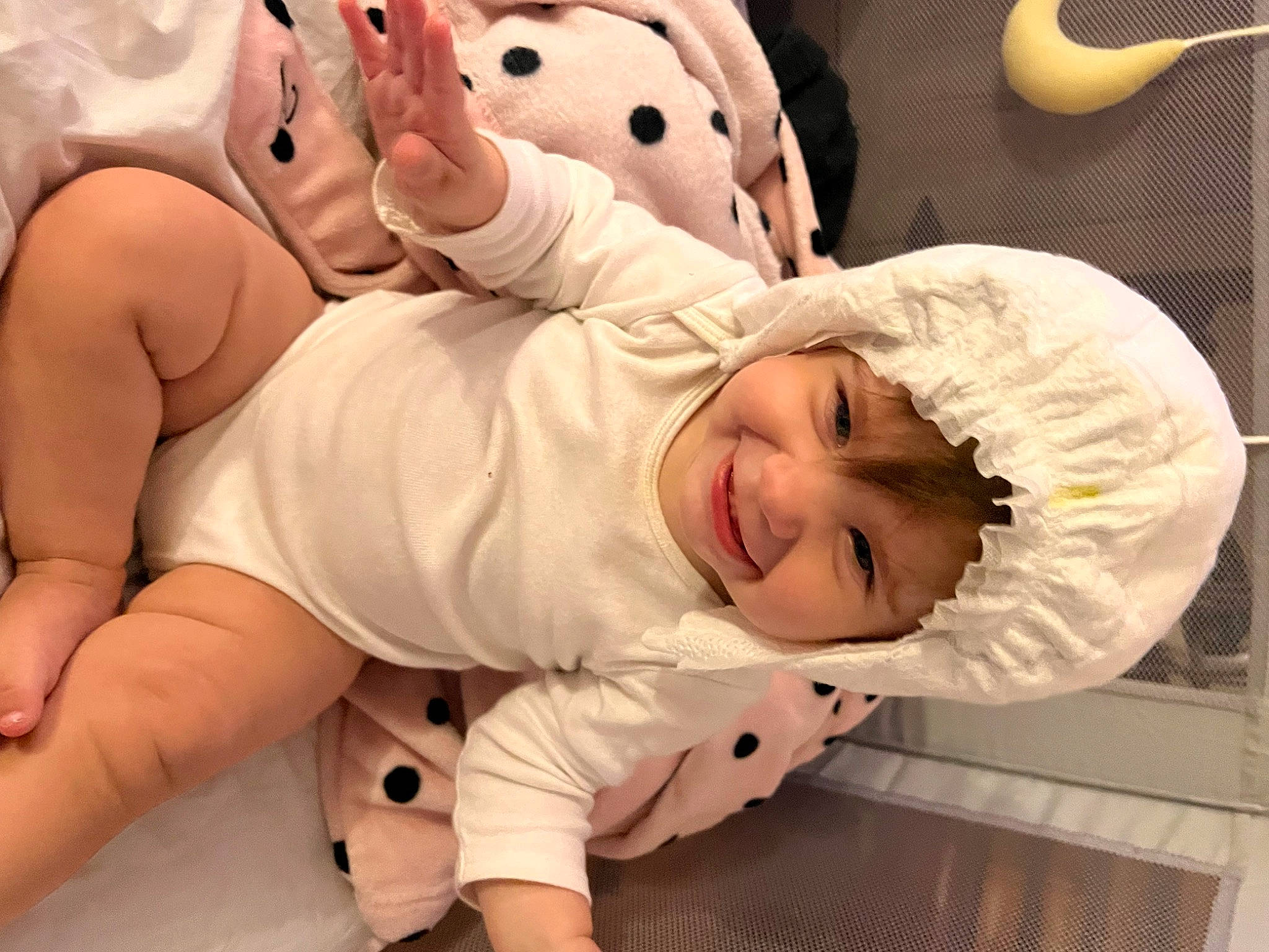 Kaelynn is registered to the contest to win money with this photo: abdomen, baby, baby_toddler_clothing, cheek, chest, child, comfort, elbow, foot, gesture, happy, headwear, human_body, joy, knee, mouth, person, sleeve, smile, stomach