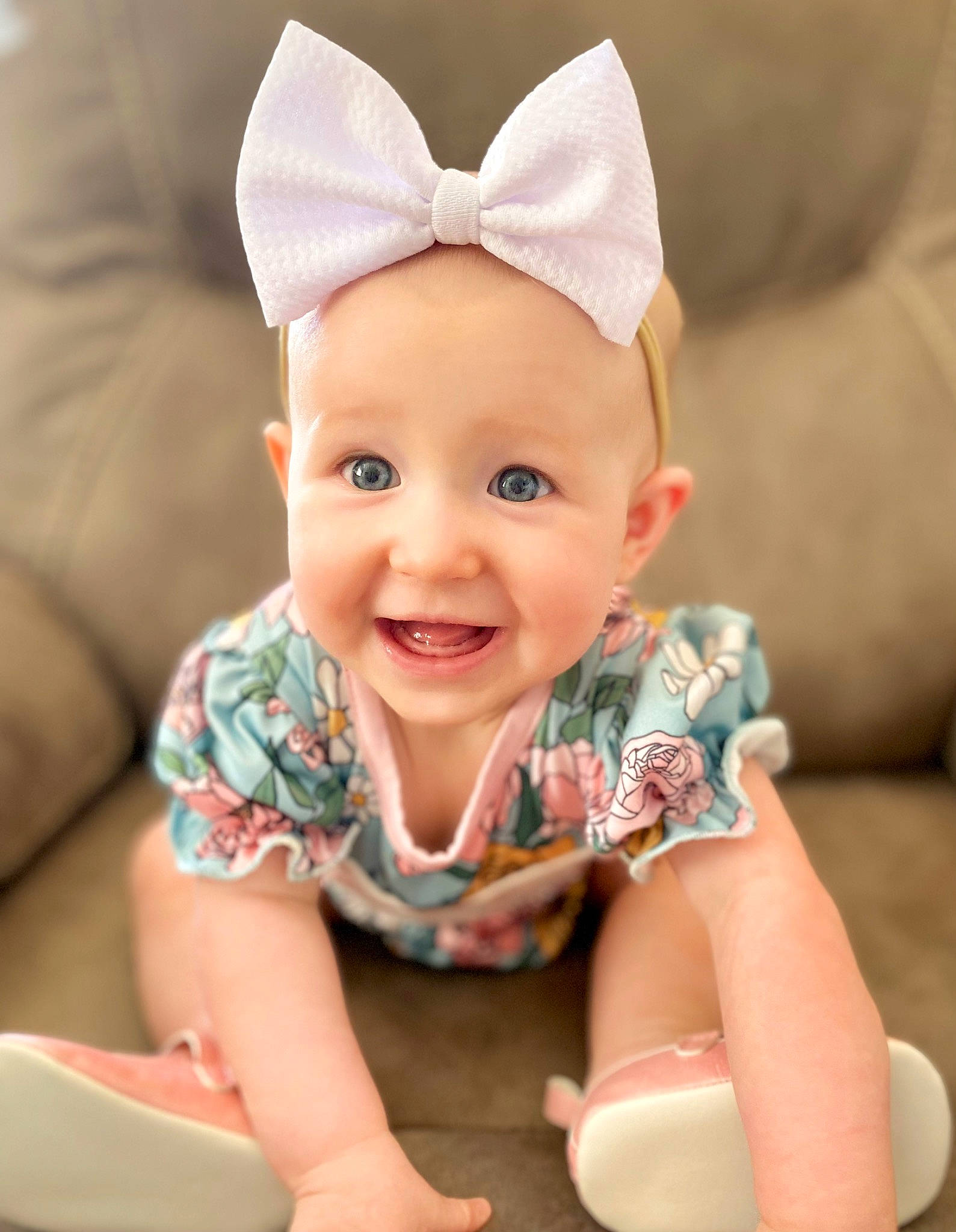 Haven is registered to the contest to win money with this photo: baby, baby_toddler_clothing, cheek, child, comfort, costume_hat, eye, fashion_accessory, fun, happy, head, human_body, joy, pattern, person, pink, product, sitting, sleeve, smile