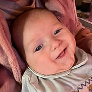 Bjorn joined the competition — help win amazing prizes! baby, smile, face, infant, blanket, clothing, closeup, portrait, cute, child, soft, warm, happy, indoors, person, newborn, expression, comfort, adorable, skin