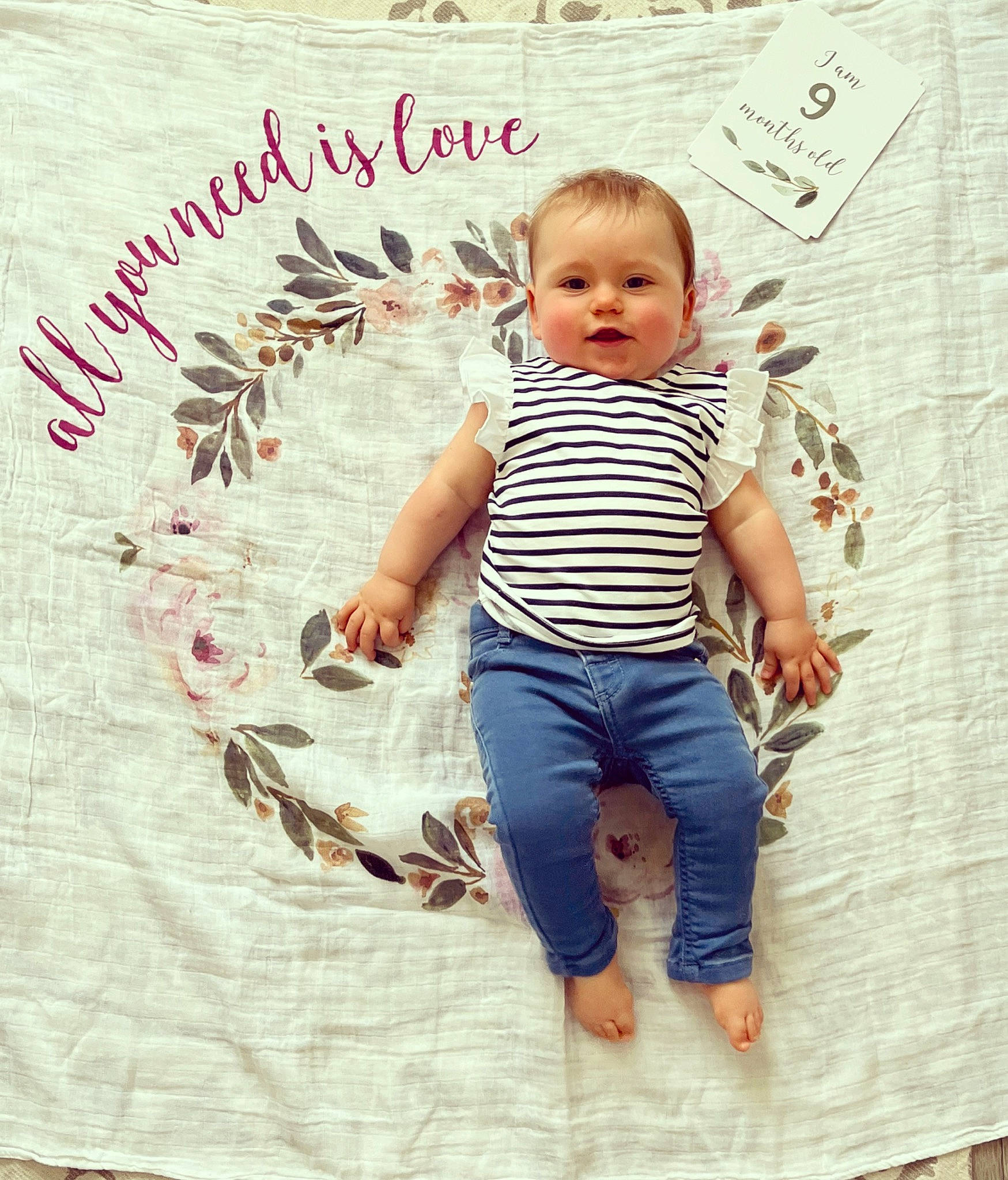 Brooke participe au concours pour gagner de l'argent avec cette photo : art, baby, baby_toddler_clothing, barefoot, child, denim, design, font, foot, happy, jeans, pattern, people_in_nature, person, product, sitting, sleeve, t_shirt, textile, toddler