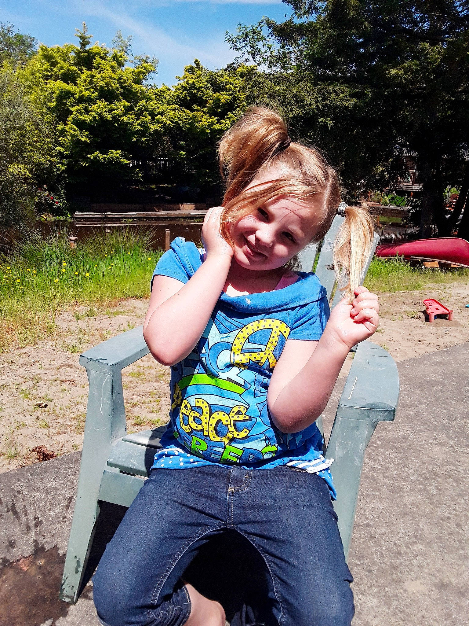 Ashlynn is registered to the contest to win money with this photo: child, fun, grass, happy, jeans, joy, leaf, leg, leisure, people, person, plant, play, playground, public_space, sitting, smile, summer, toddler, tree