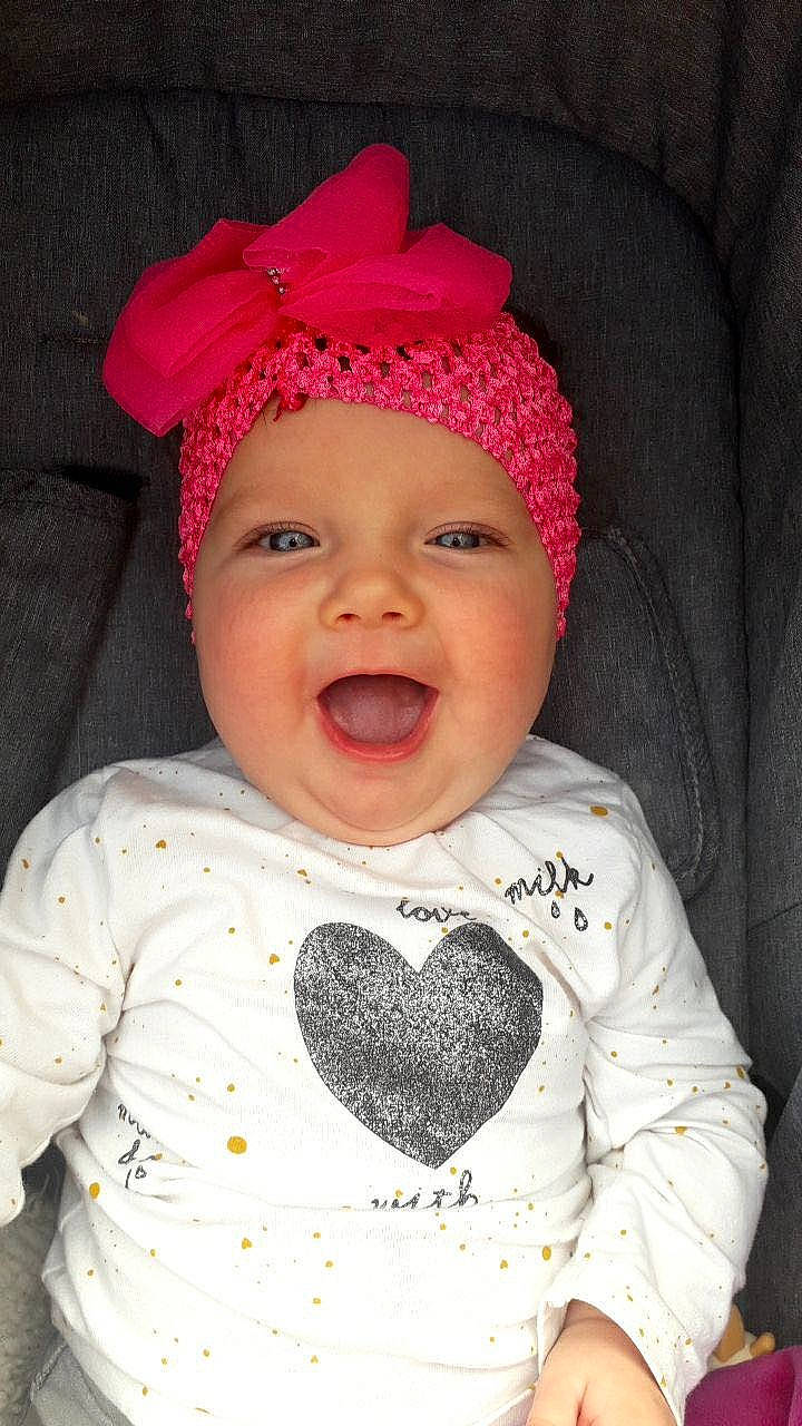 Tahynna participe au concours pour gagner de l'argent avec cette photo : baby, baby_toddler_clothing, cap, cheek, chin, cool, eye, face, facial_expression, happy, head, headwear, lip, organ, outerwear, person, pink, skin, sleeve, smile