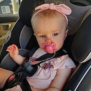 Everleigh joined the competition — help win amazing prizes! baby, child, car_seat, pacifier, pink_headband, pink_outfit, strawberry_pattern, safety_harness, car_interior, seatbelt, infant, cute, child_seat, window, daylight, portrait, young_child, baby_girl, curious, casual