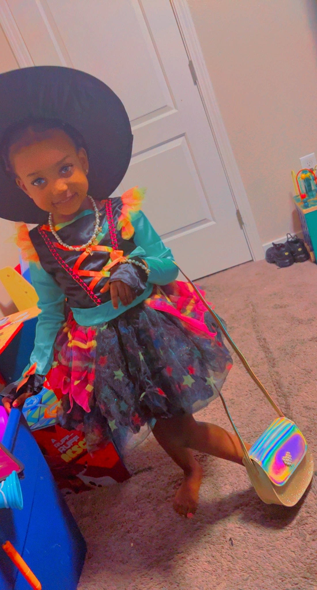 Jaliah is registered to the contest to win money with this photo: baby_toddler_clothing, barefoot, child, door, dress, event, fashion_accessory, flooring, foot, fun, happy, hat, human_leg, joy, magenta, person, pink, sandal, sleeve, smile