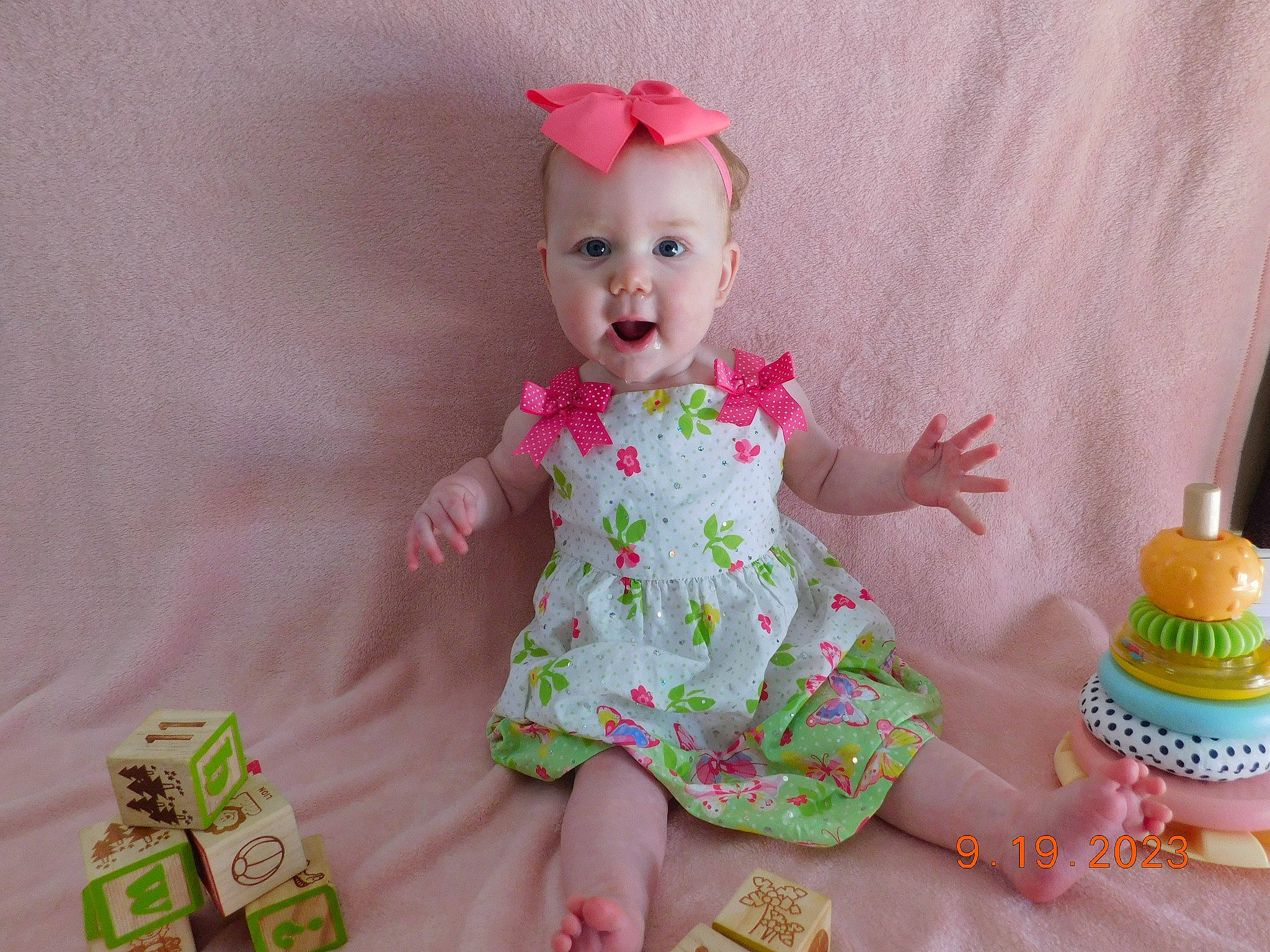 Skylar joined the competition — help win amazing prizes! baby, baby_toddler_clothing, cake_decorating, cake_decorating_supply, child, costume_hat, day_dress, dress, embellishment, hat, icing, magenta, pattern, person, pink, sitting, skin, sleeve, sugar_cake, surprise