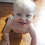 baby, child, crawling, floor, wooden_floor, smiling, happy, indoor, skin, hands, face, eyes, mouth, infant, person, cute, young_child, home, natural_light, bare_chest