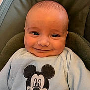Liam a rejoint le concours — aidez-le/la à gagner de superbes lots ! baby, smiling, infant, face, mickey_mouse, clothing, cute, portrait, child, young, happy, sitting, soft, indoors, head, expression, warm, cozy, apparel, babywear