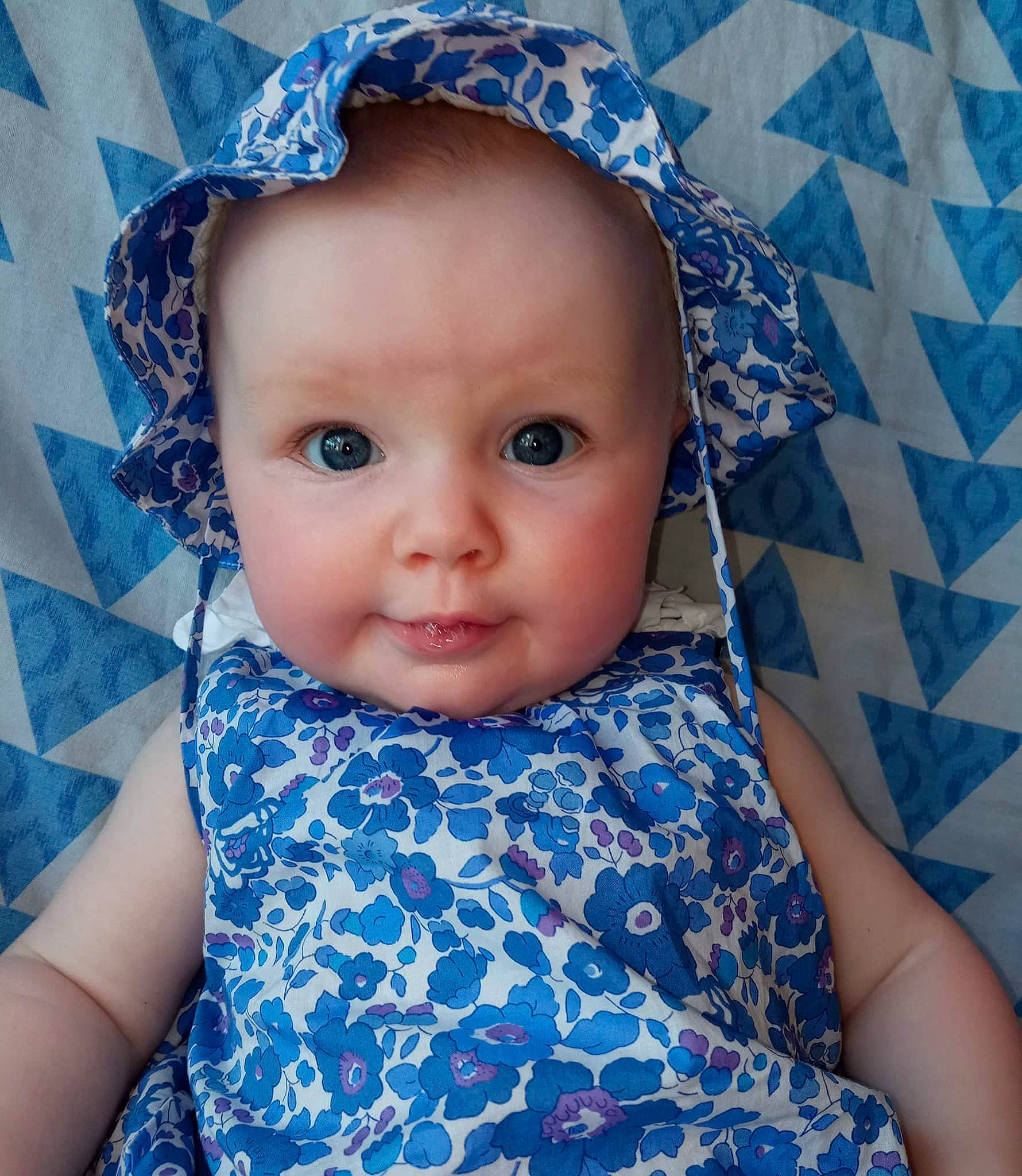 Yliana participe au concours pour gagner de l'argent avec cette photo : azure, baby, baby_toddler_clothing, blue, cheek, chin, dress, eye, eyebrow, eyelash, hair, happy, head, iris, lip, person, purple, skin, sleeve, textile