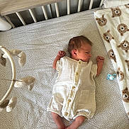 Maddox joined the competition — help win amazing prizes! baby, newborn, crib, blanket, mobile, sleeping, romper, infant, nursery, bed, patterned_sheet, bear_print, pacifier, wooden_crib, soft_toys, peaceful, child, indoors, sleep, cute