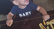 Micaiah is registered to the contest to win money with this photo: baby, child, toddler, smiling, laughing, face, portrait, restaurant, dining_room, table, french_fries, food, eating, high_chair, chair, blue_shirt, short_hair, indoor, happy, casual_photo