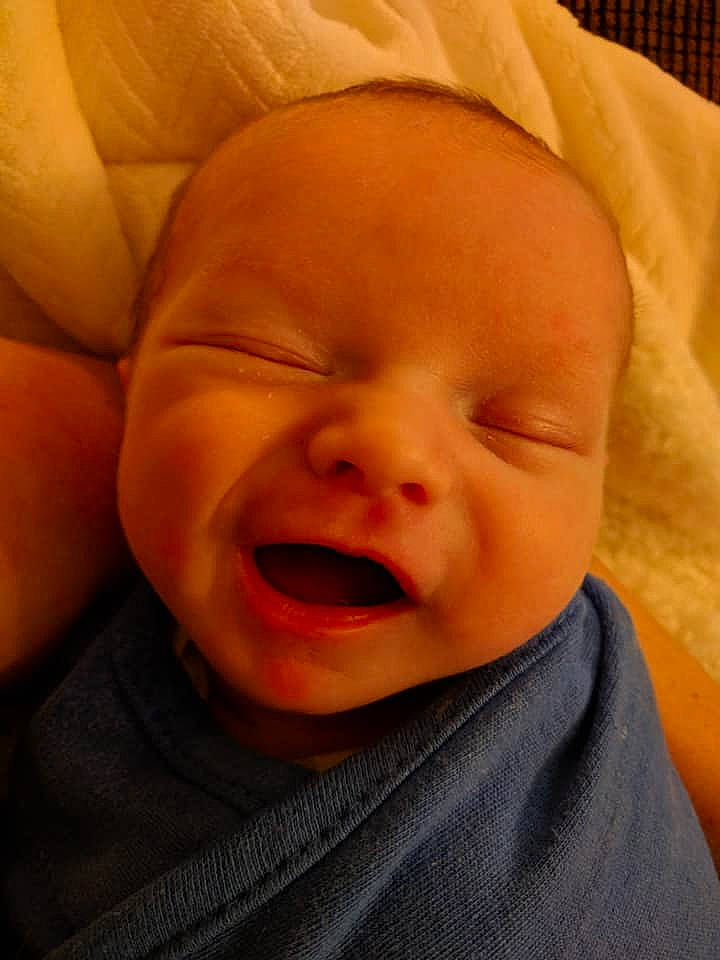 Sullivan is registered to the contest to win money with this photo: cheek, child, chin, close_up, face, forehead, head, infant, laughter, lip, mouth, nose, person, skin, smile, toddler