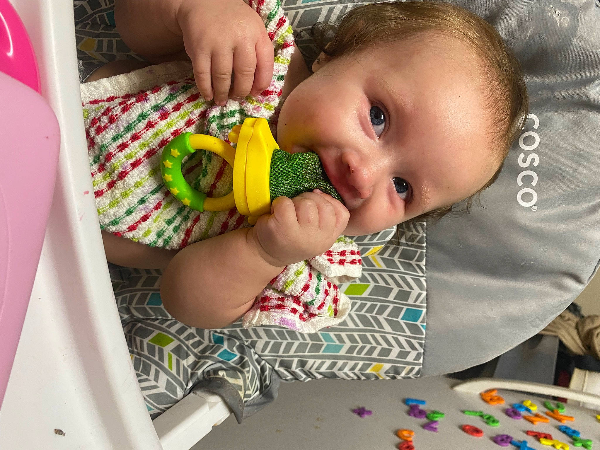 Nayla is registered to the contest to win money with this photo: baby, baby_playing_with_toys, baby_products, baby_toddler_clothing, cheek, child, face, finger, flooring, fun, hand, happy, head, iris, nail, pattern, person, sitting, skin, smile