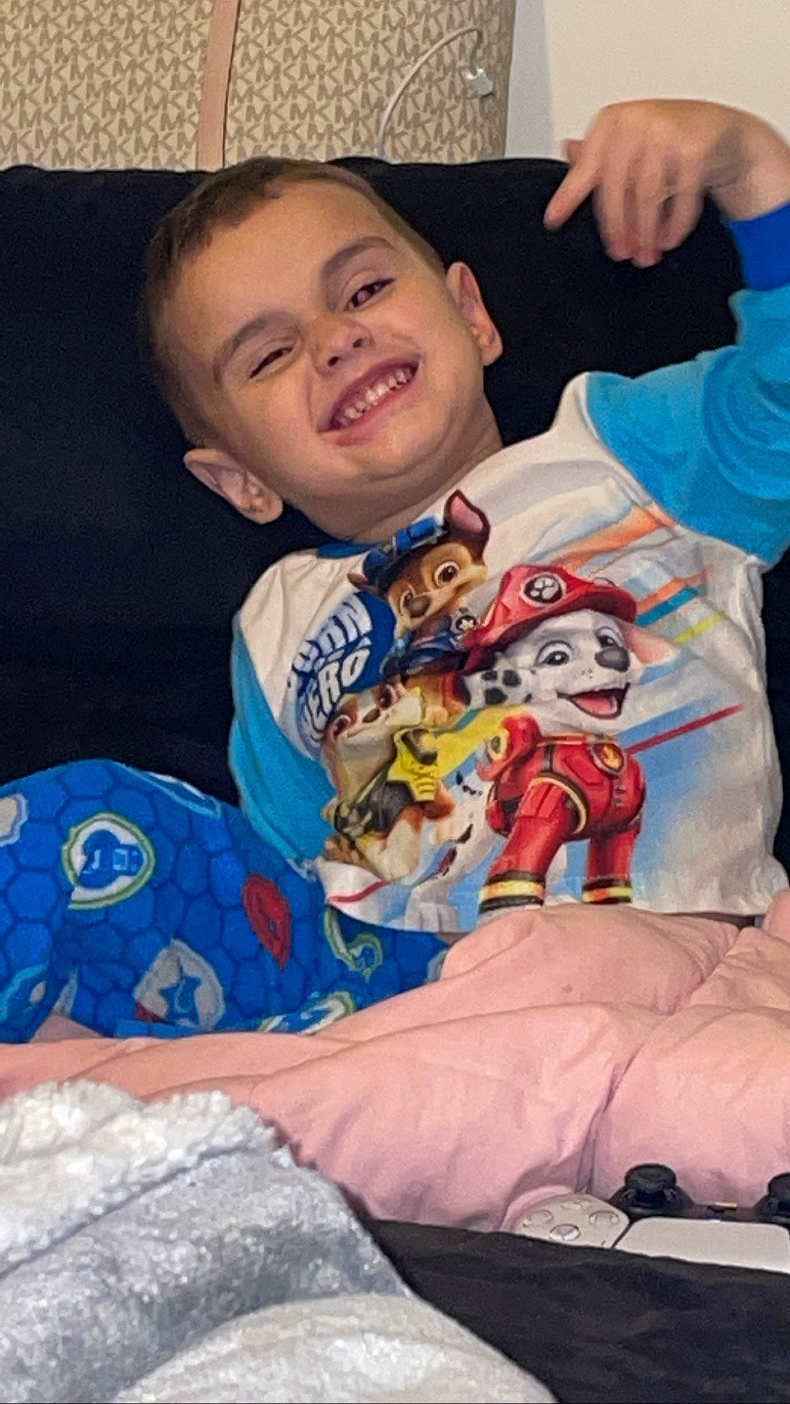 Cameron is registered to the contest to win money with this photo: carmine, child, christmas, event, eye, face, fictional_character, fun, gesture, hand, happy, head, joy, linens, person, sitting, sleeve, smile, stuffed_toy, t_shirt