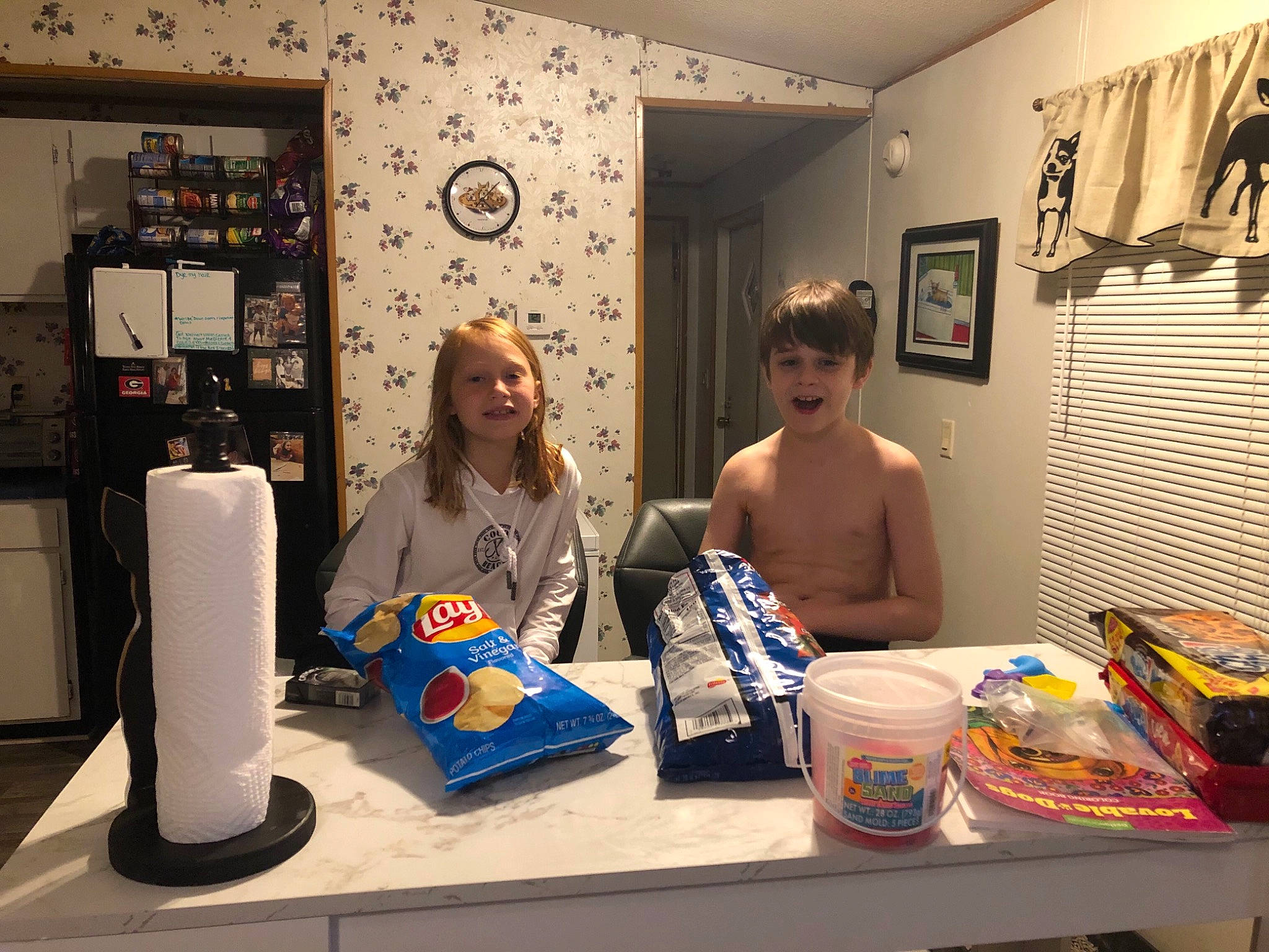 Sj is registered to the contest to win money with this photo: art, artist, automotive_design, collection, desk, event, eyewear, fashion_design, flooring, fun, illustration, joy, office_equipment, paper_towel, person, picture_frame, plastic, room, shelving, t_shirt