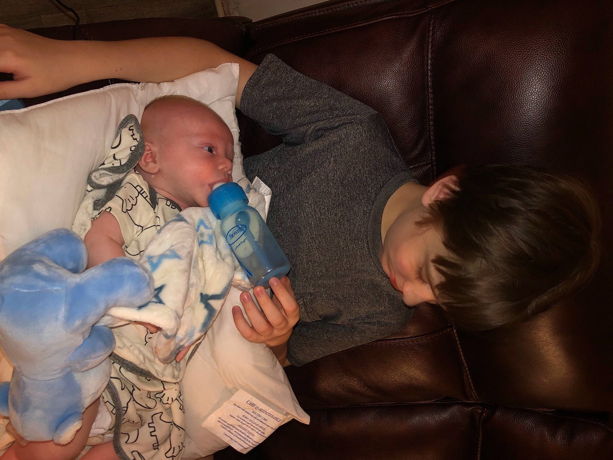 Sj joined the competition — help win amazing prizes! abdomen, baby, baby_products, bedtime, bottle, cheek, child, comfort, couch, finger, head, human_body, lap, mouth, nail, person, room, sitting, skin, thumb