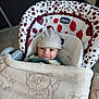 baby, infant, smile, hat, blanket, baby_seat, chicco, polka_dots, red, maroon, white, cozy, indoor, child, young, cute, comfort, portrait, happy, face