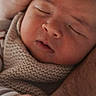 newborn, baby, sleeping, hand, adult_hand, knitted_blanket, cozy, close_up, portrait, skin, face, peaceful, resting, infant, cuddle, soft_lighting, family, love, tenderness, warmth