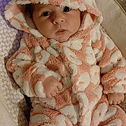 Cloëly participe au concours pour gagner de l'argent avec cette photo : baby, infant, onesie, hood, pink, white, fluffy, animal_ears, cute, face, eyes, hand, cushion, pattern, soft, child, portrait, indoor, warm, cozy