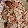 baby, infant, onesie, hood, pink, white, fluffy, animal_ears, cute, face, eyes, hand, cushion, pattern, soft, child, portrait, indoor, warm, cozy