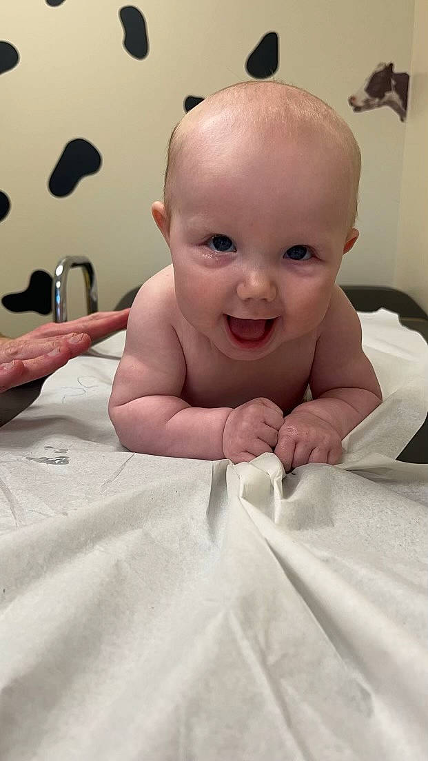 Braelynn is registered to the contest to win money with this photo: baby, baby_toddler_clothing, bathing, cheek, child, comfort, ear, eye, eyelash, finger, flooring, happy, iris, joy, lip, mouth, nose, person, skin, smile