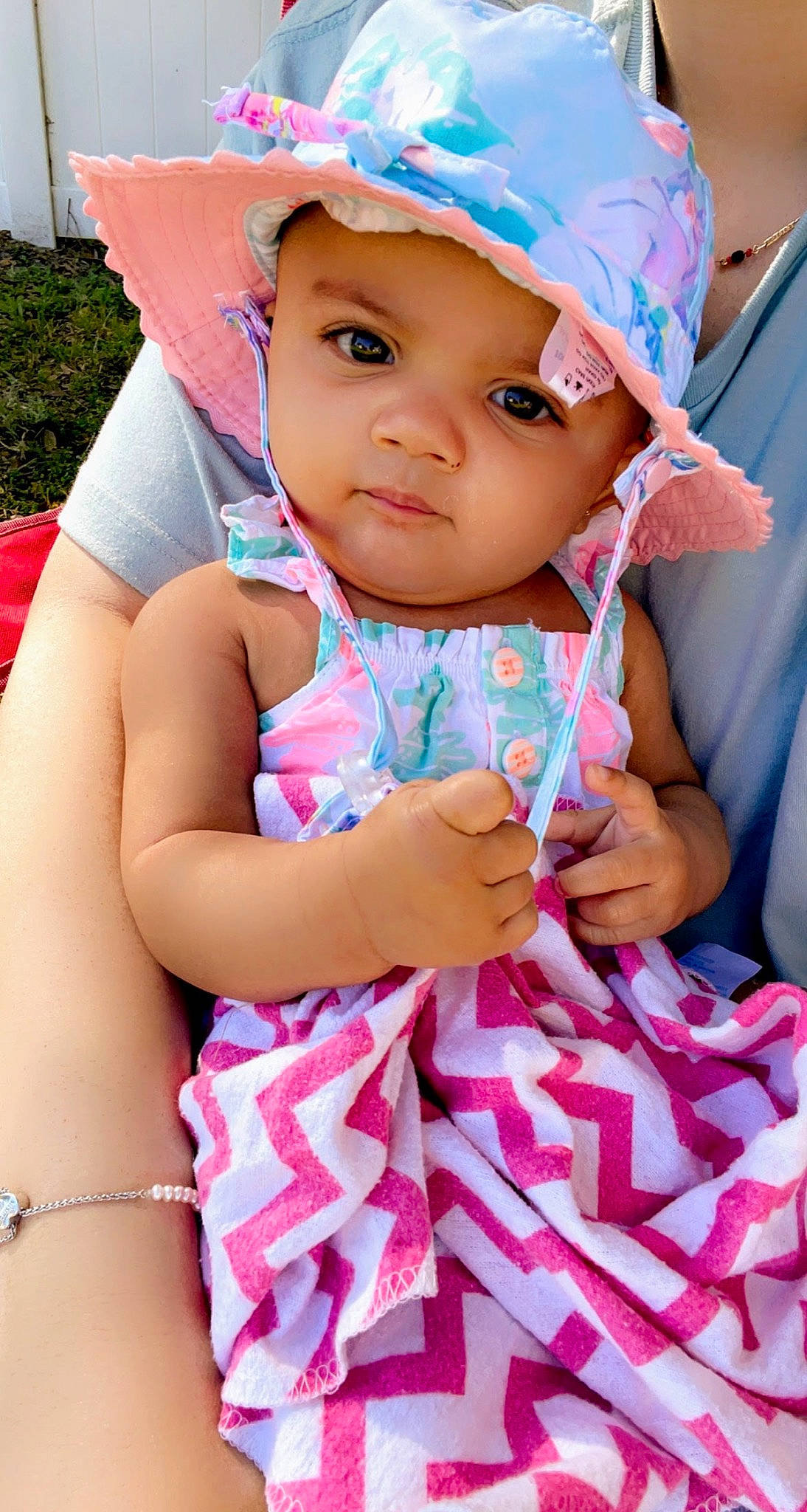 Avani joined the competition — help win amazing prizes! azure, baby, baby_toddler_clothing, blue, cap, cheek, facial_expression, finger, hairstyle, hand, happy, head, headwear, lip, organ, person, pink, skin, sun_hat, textile
