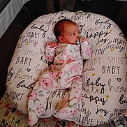 Harper Rose is registered to the contest to win money with this photo: baby, blanket, crib, cushion, face, furniture, head, homedecor, infantbed, person, text