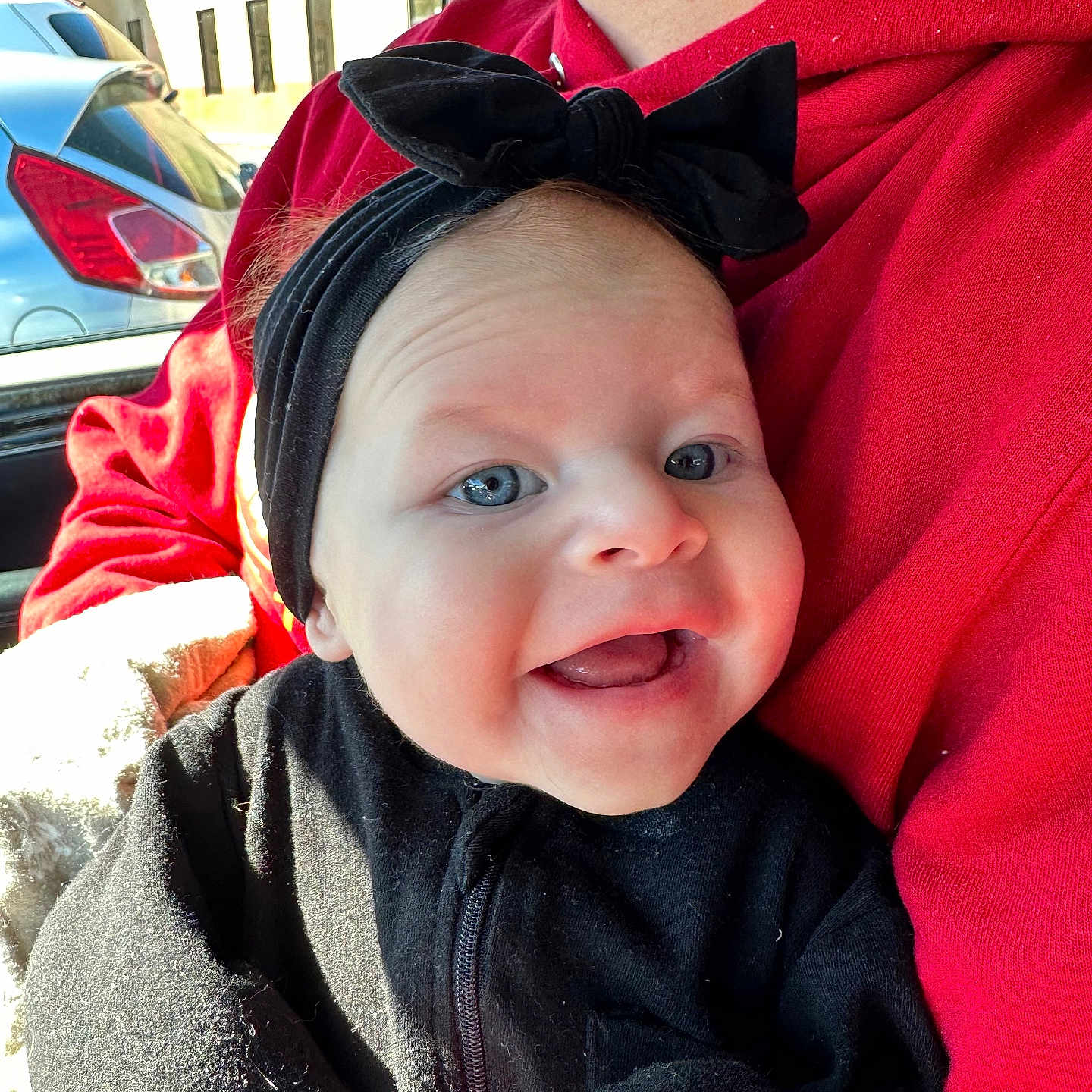 Aurora is registered to the contest to win money with this photo: alloywheel, baby, car, carwheel, clothing, coat, face, happy, hat, head, jacket, machine, person, photography, portrait, spoke, tire, transportation, vehicle, wheel