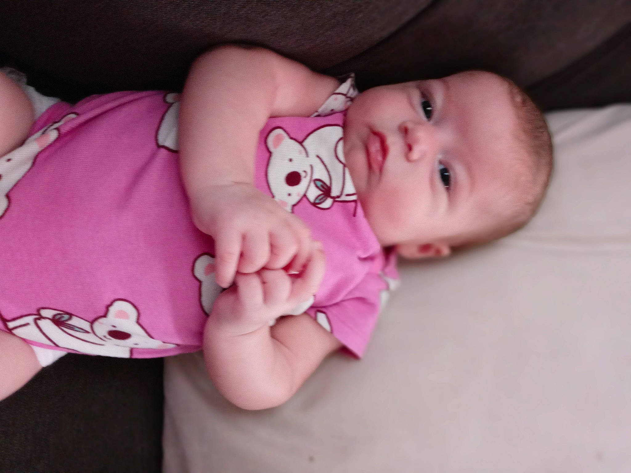 Arielle is registered to the contest to win money with this photo: arm, baby, baby_toddler_clothing, cheek, comfort, eyelash, finger, headgear, human_body, leg, lip, mouth, nail, neck, nose, person, pink, skin, sleeve, stomach