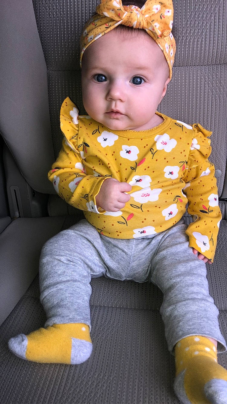 Halley is registered to the contest to win money with this photo: baby, baby_products, baby_toddler_clothing, car_seat, cheek, child, comfort, costume_accessory, eye, headband, headpiece, headwear, human, human_body, lap, mammal, mouth, nose, person, sitting