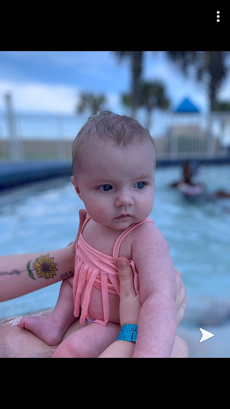 Halley is registered to the contest to win money with this photo: aqua, baby, baby_toddler_clothing, bracelet, cheek, chest, child, finger, hand, joint, muscle, nail, organ, person, pink, skin, stomach, swimming_pool, thumb, toddler