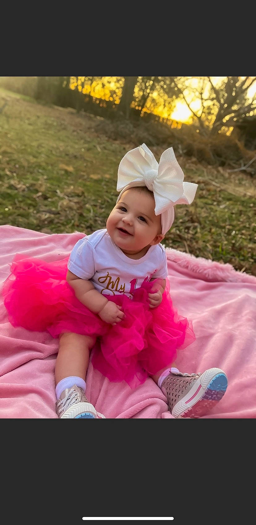 Lillianna joined the competition — help win amazing prizes! baby, baby_toddler_clothing, child, event, fun, grass, happy, hat, headwear, joy, lawn, leisure, magenta, person, pink, plant, purple, recreation, shoe, sitting