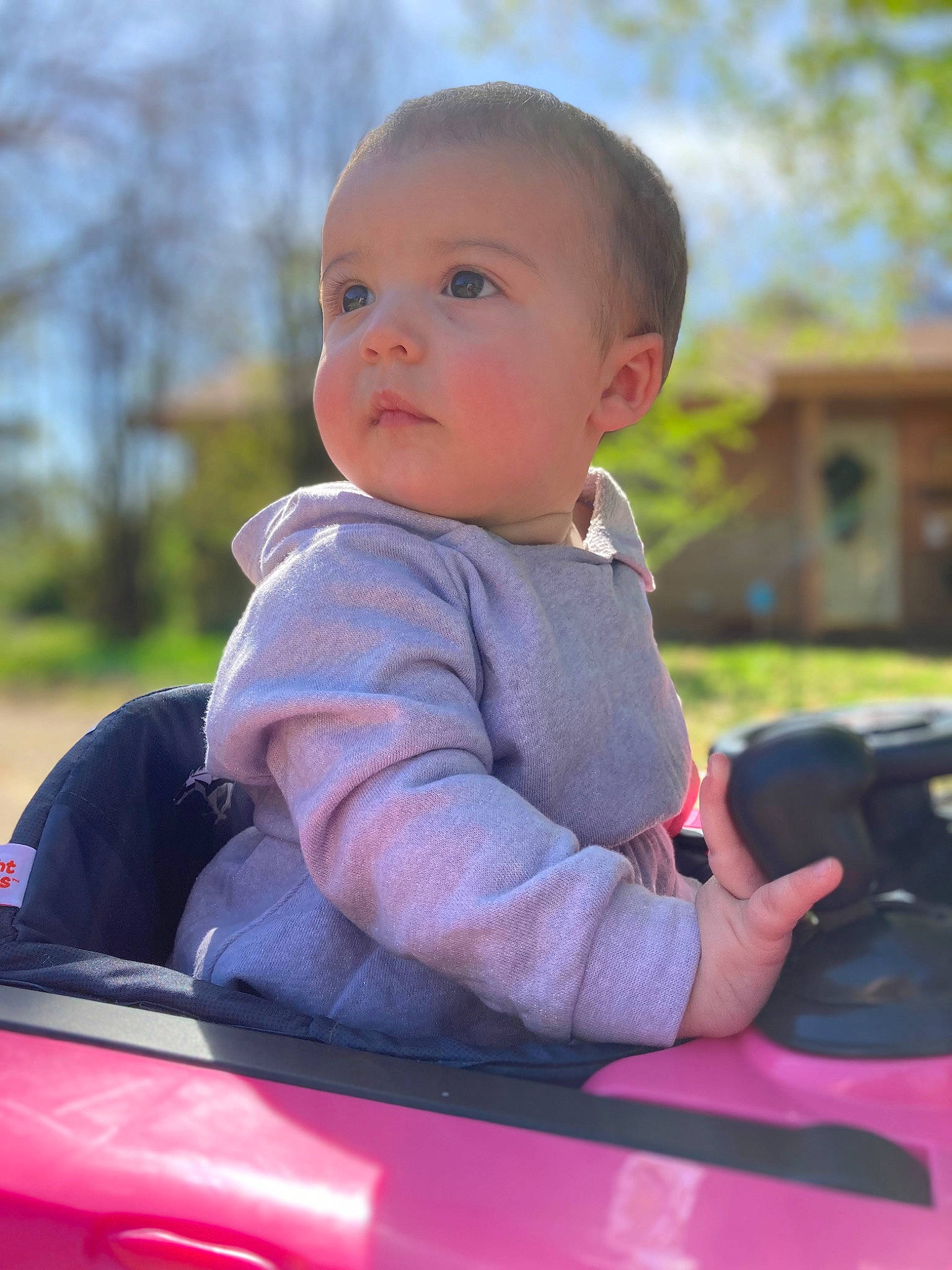 Lillianna is registered to the contest to win money with this photo: automotive_design, automotive_exterior, automotive_lighting, baby, baby_toddler_clothing, bumper, car, child, grass, happy, hood, leisure, motor_vehicle, person, sky, toddler, tree, vehicle, vehicle_door, window