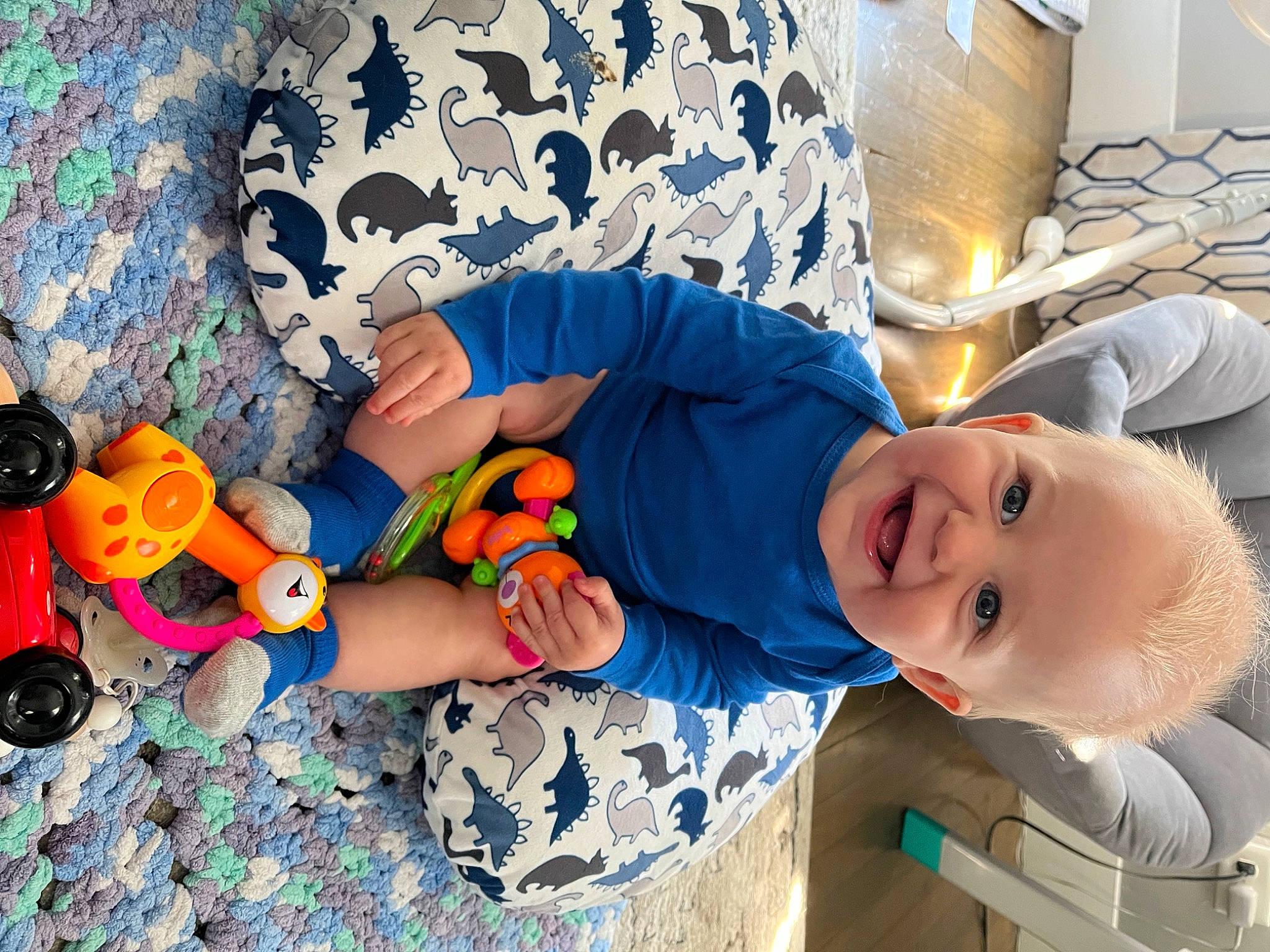 Leland joined the competition — help win amazing prizes! arm, baby, baby_toddler_clothing, child, eye, fun, hand, happy, human_body, human_leg, leg, leisure, mouth, orange, person, product, sitting, smile, t_shirt, toddler